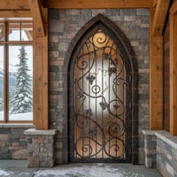 Arched Glass Door With Wrought Iron Vine Design Set in Stone Facade