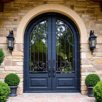 Arched Double Front Door With Black Wrought Iron and Fleur-de-lis Details