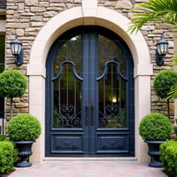Arched Double Entry Door With Intricate Ironwork and Decorative Lantern Sconces