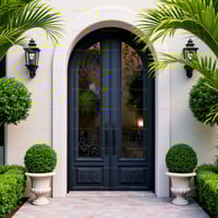 Arched Double Door With Wrought Iron, Flanked by Lanterns and Urns