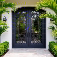 Arched Dark Gray Double Door With Wrought Iron and Stone Walkway