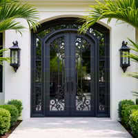 Arched Dark Gray Metal Double Doors With Decorative Scrollwork and Sidelights