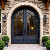Arched Double Front Door With Wrought Iron, Flanked by Lanterns and Stone Archway