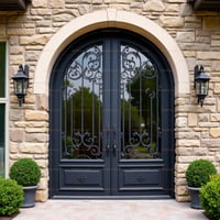 Double Arched Metal Door With Glass Panes and Wrought Iron Details