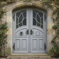 Arched Wooden Doors With Geometric Glass, Stone Archway, and Ornate Iron Hardware