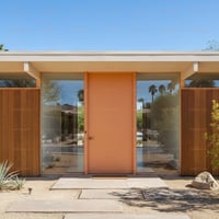 Peach Flat-panel Door With Horizontal Lever in Mid-century Modern Entryway