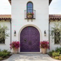 Arched Purple Double Door With Grapevine Carvings and Stone Archway