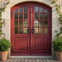 Elegant Red Arched Double Doors With Textured Glass and Stone Archway