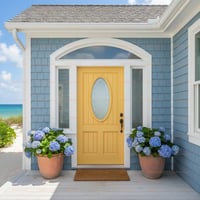 Yellow Entry Door With Oval Glass, Sidelights, and Arched Transom