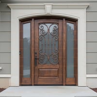 Arched Wood Front Door With Wrought Iron Glass and Stone Surround