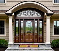 Ornate Leaded Glass Entry Door With Arched Transom and Fluted Columns