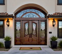 Mediterranean Double Door With Arched Transom, Decorative Ironwork, and Sidelights
