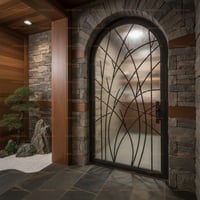 Arched Obscured Glass Door With Dark Metal Branch Design and Stone Surround
