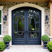Ornate Ironwork Double Doors With Arched Frame and Vintage Lanterns