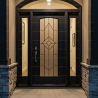 Arched Black Front Door With Geometric Glass Panel and Stone Columns